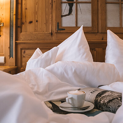 Bett in einer Unterkunft in Ischgl Zentrum 4*S Hotel Solaria